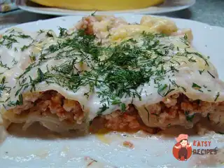 Каннеллоні з м'ясною начинкою під соусом бешамель